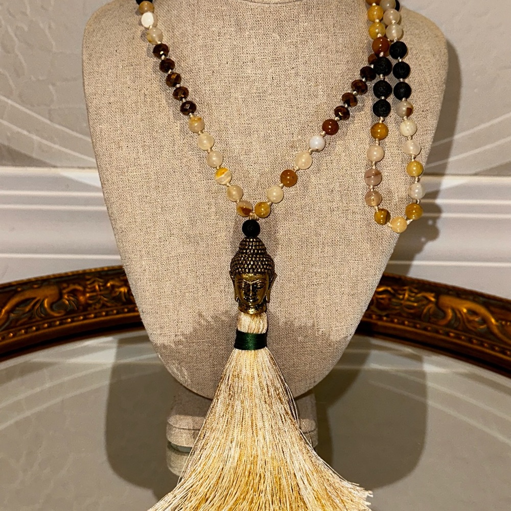 Gorgeous Mala with heavy Buddha guru bead with ivory tassel.  Gorgeous beads